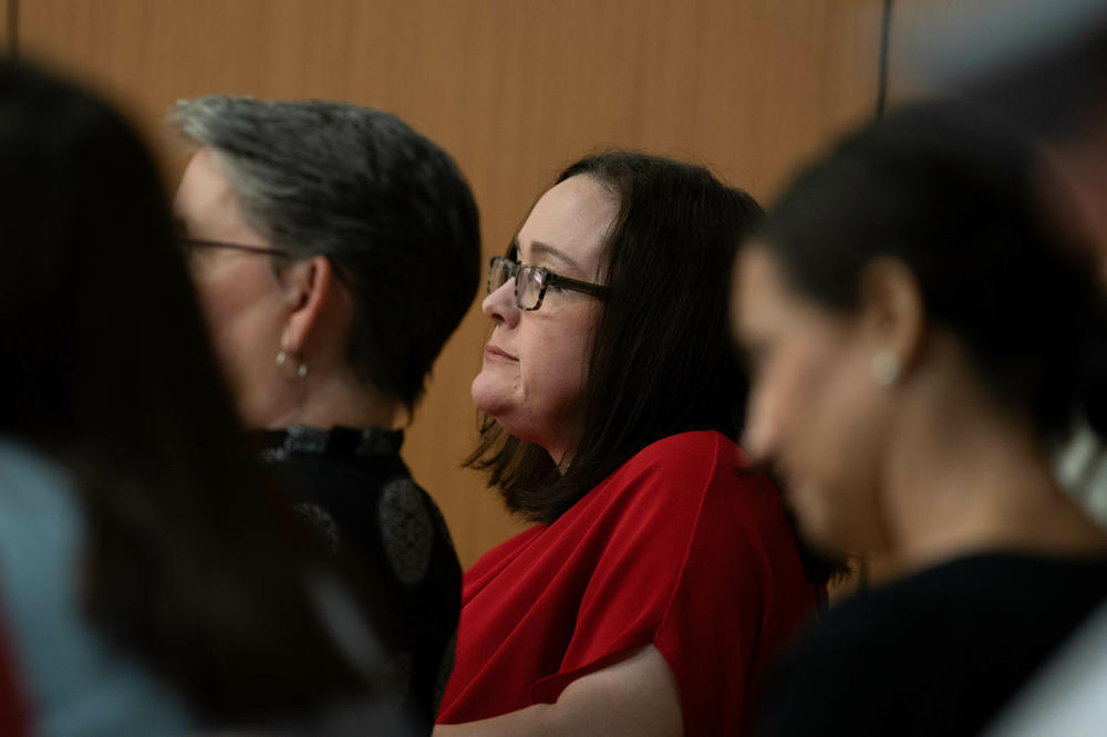 Despite being harassed and threatened, librarian Amanda Jones — seen here attending a Livingston Parish Council meeting on July 17, 2023 — says she will not cave to the pressure. After a long medical leave, she returns to her school librarian job this month.