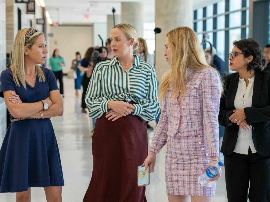 Plaintiffs Amanda Zurawski (far left), Austin Dennard, Taylor Edwards, and Elizabeth Weller speak together at the Travis County Courthouse on July 20, 2023 in Austin, Texas.