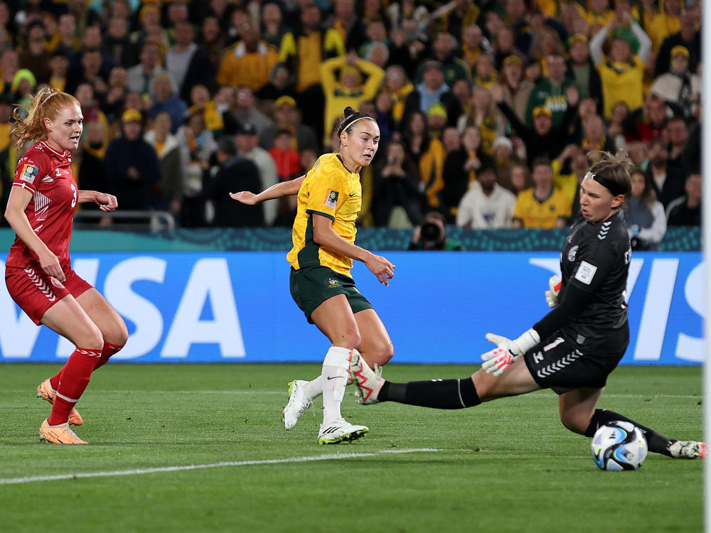 Australia's Caitlin Foord shoots the ball past Denmark goalkeeper Lene Christiansen in Brisbane on Monday. Australia beat Denmark 2-0.
