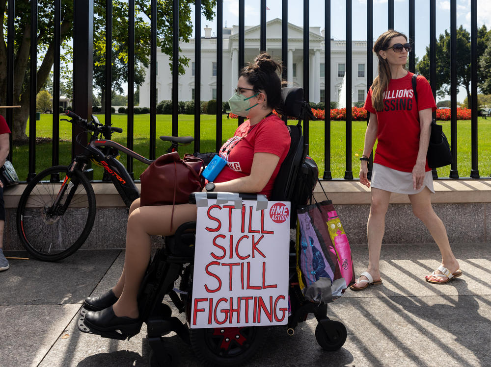Protesters march outside the White House to call attention to those who have long COVID and those who have the disabling disease Myalgic encephalomyelitis/chronic fatigue syndrome (ME/CFS).