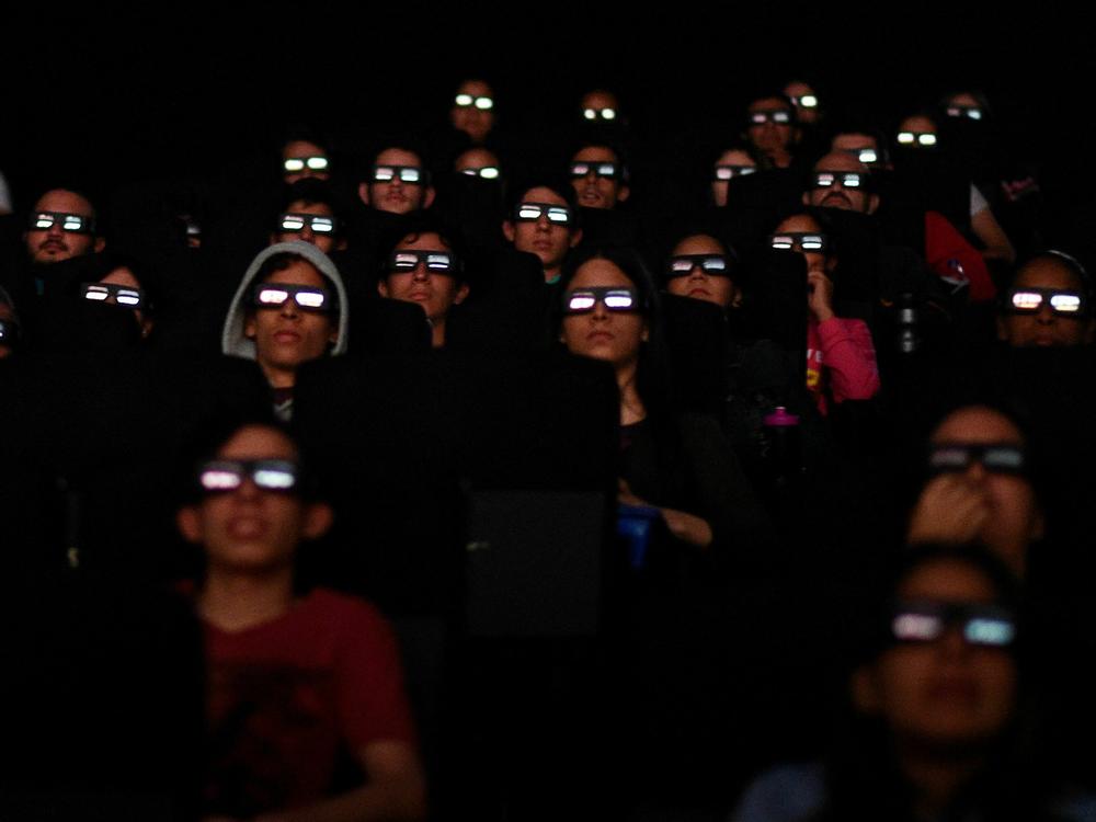 Filmgoers watch a screening of Marvel Studios' <em>Avengers: Endgame</em> at a cinema in Caracas in April 2019. More than 50 workers at Marvel Studios in LA, New York and Atlanta have signed authorization cards to be represented by the International Alliance of Theatrical Stage Employees, or IATSE.