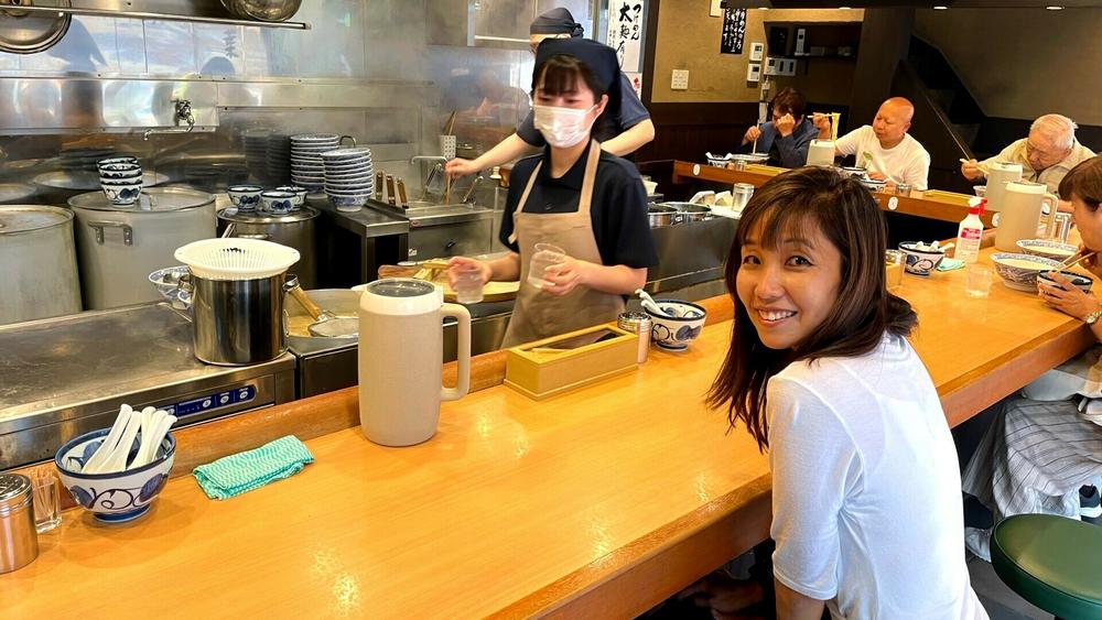 NPR's Yuki Noguchi awaits a bowl of ramen noodles in a Tokyo restaurant.