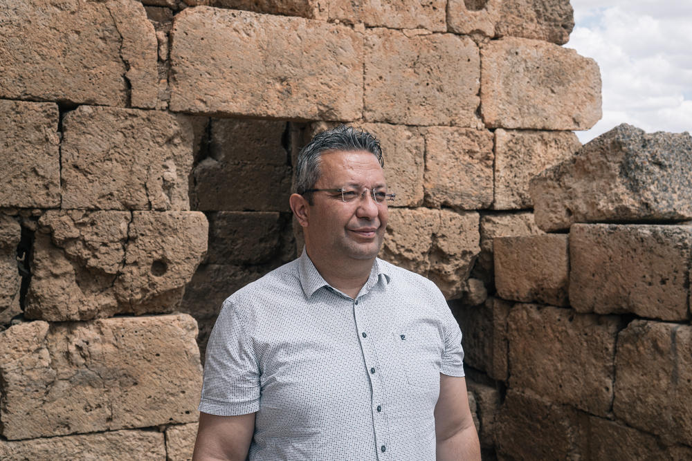 Archaeologist Aytac Coskun, seen at ruins of an ancient church, says excavations in the area may continue for another three decades.