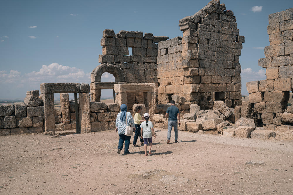 A local family visiting Zerzevan Castle archaeological site.