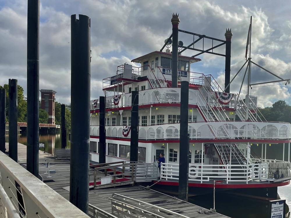 The Harriott II riverboat sits at the Riverfront dock in Montgomery, Ala. Three white men have been charged with assault for attacking the ship's co-captain last Saturday, which turned into a brawl along racial lines, as seen in dozens of videos online.