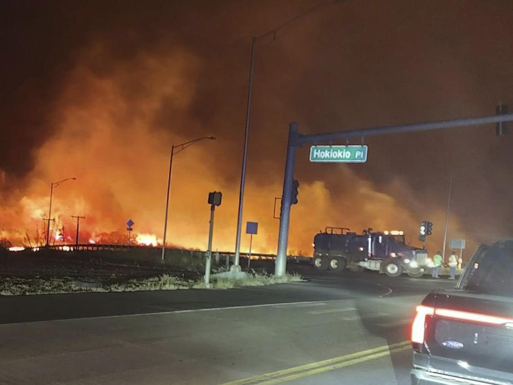 This photo provided by County of Maui shows fire and smoke filling the sky from wildfires near the Lahaina Bypass in Maui, Hawaii, on Tuesday.