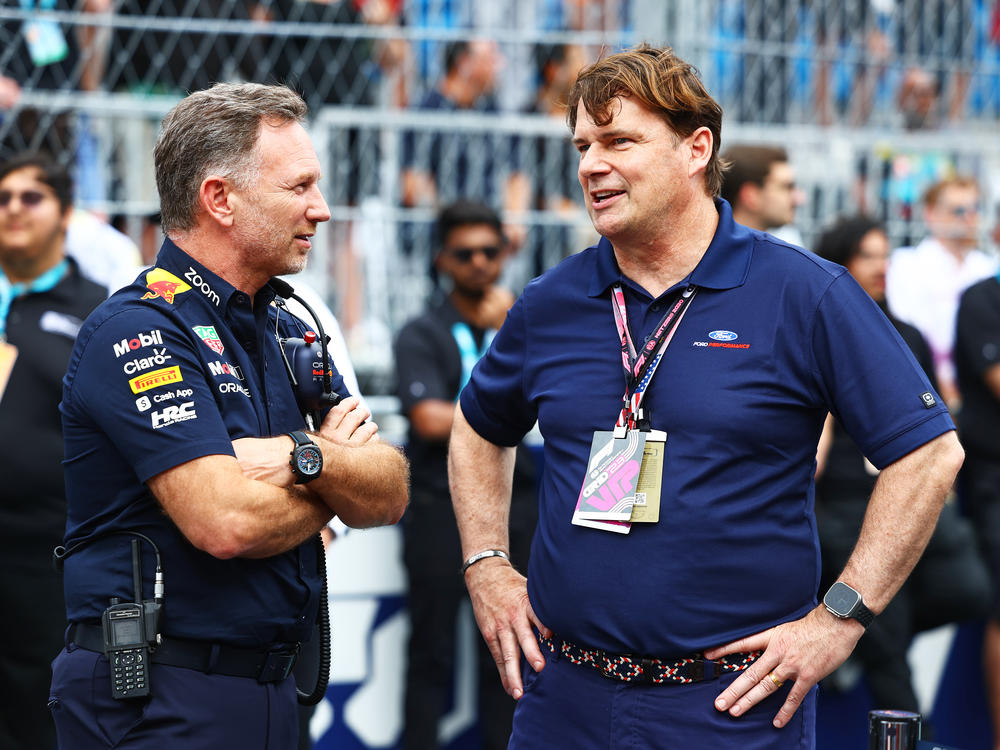 Red Bull Racing Team Principal Christian Horner talks with Ford CEO Jim Farley during the F1 Grand Prix of Miami at Miami International Autodrome in Miami on May 7, 2023. A bio line on Farley.