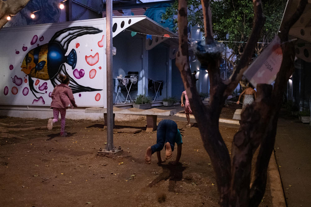 Children play around Vila Reencontro — the project providing homes for the unhoused in São Paulo. The family interviewed by NPR was thrilled to have a safe place for their son to play.