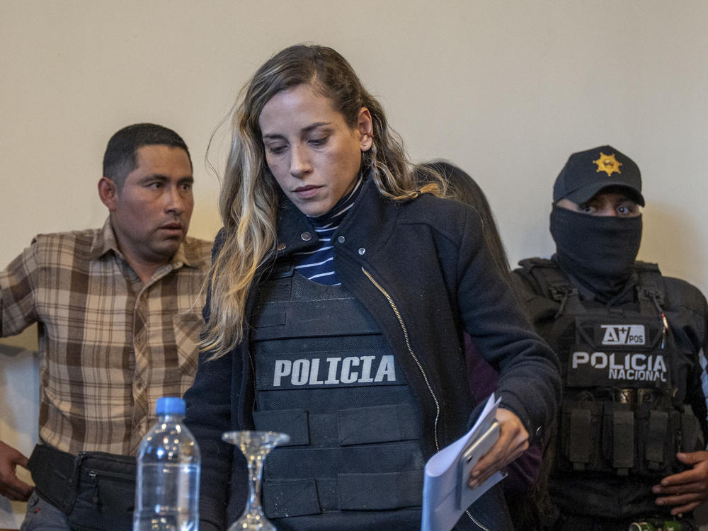 Wearing a bulletproof vest, Andrea Gonzalez, the running mate of slain presidential candidate Fernando Villavicencio, arrives for a press conference in Quito, Ecuador, Thursday, Aug. 10, 2023.