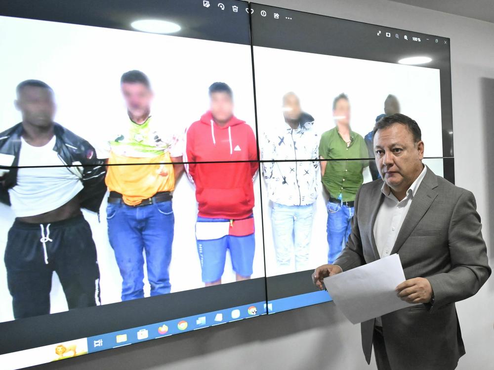 Ecuador's Interior Minister Juan Zapata leaves after giving a report on arrests in connection with assassination of presidential candidate Fernando Villavicencio, at police headquarters in Quito, on Thursday.