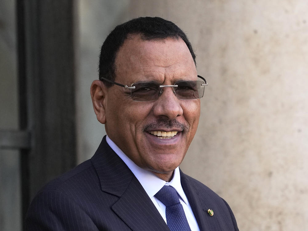 Niger's President Mohamed Bazoum smiles before a working lunch with French President Emmanuel Macron, Feb. 16, 2023 at the Elysee Palace in Paris.