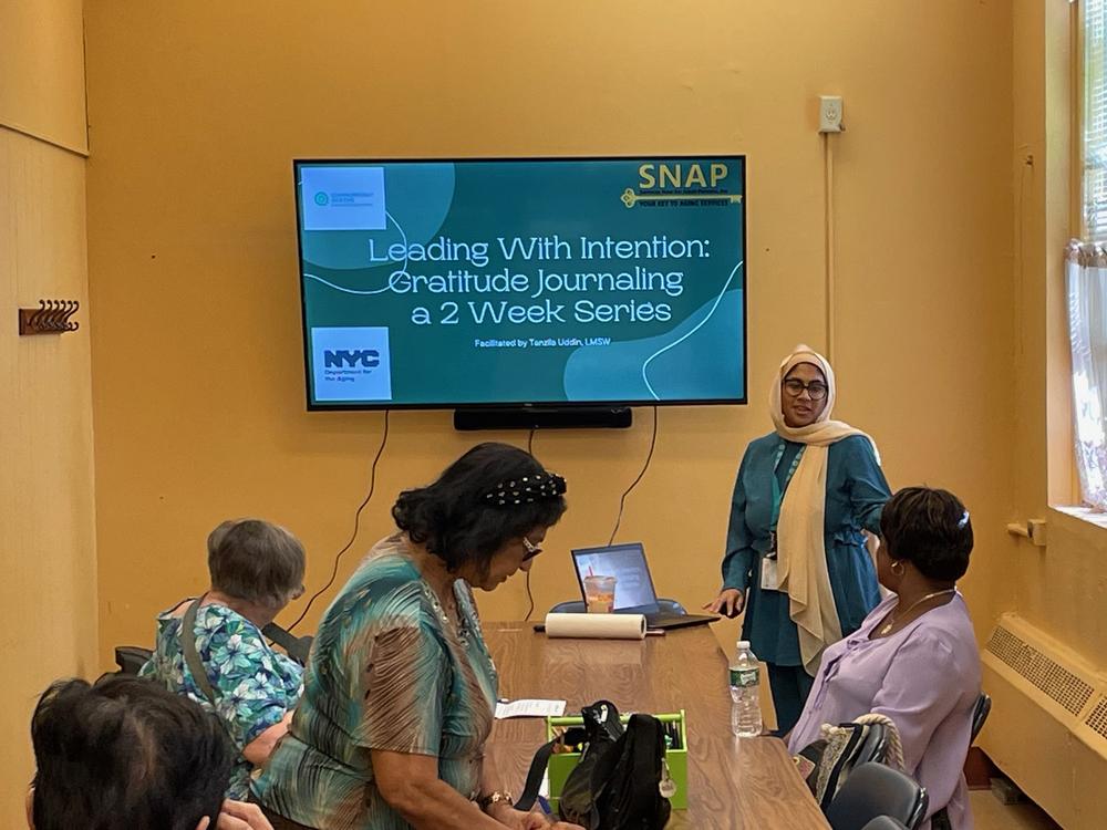 Social worker Tanzila Uddin leads a workshop on journaling at a senior center in Queens Village in NYC. These gatherings can identify older adults who may need more mental health treatment.