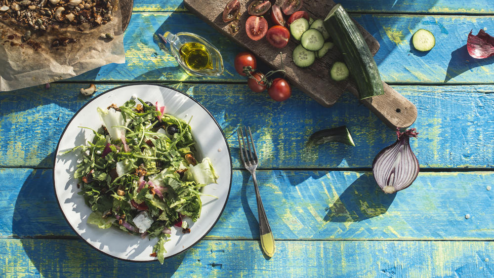 Greek salad with arugula, Little Gem, cheece, olives, tomatoes, cucumber, onion and caramelized nuts. Bulgaria, Plovdiv