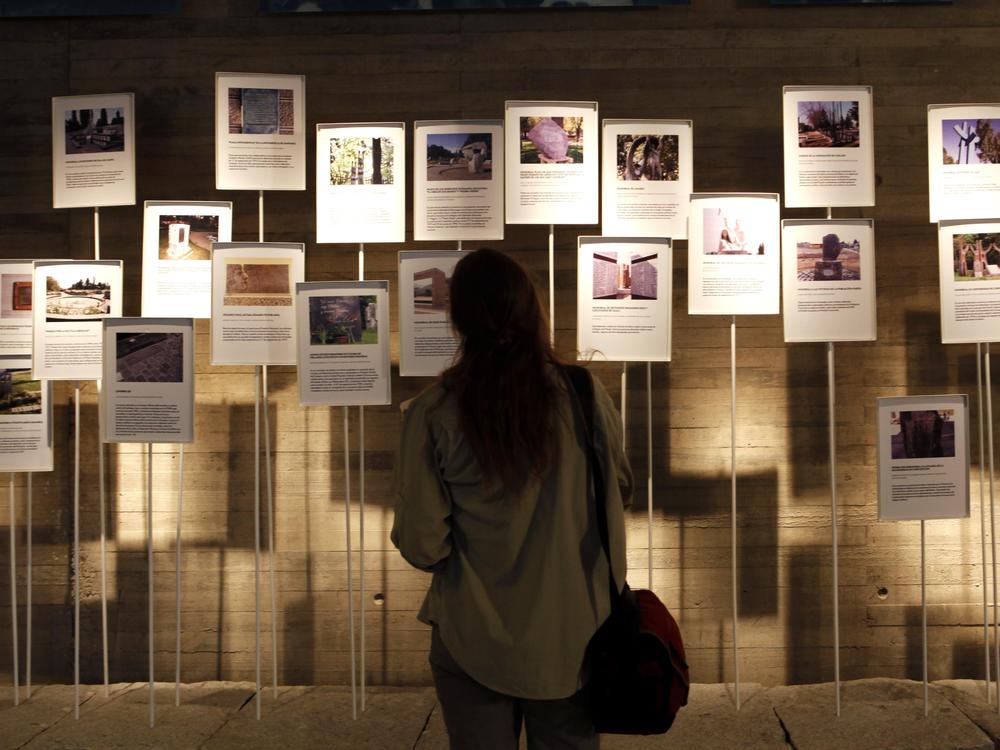 A visitor looks at a display on the opening day of the Memory and Human Rights Museum in Santiago on Jan. 11, 2010. The museum is dedicated to remembering the tens of thousands of people imprisoned, tortured or killed during the Pinochet dictatorship.