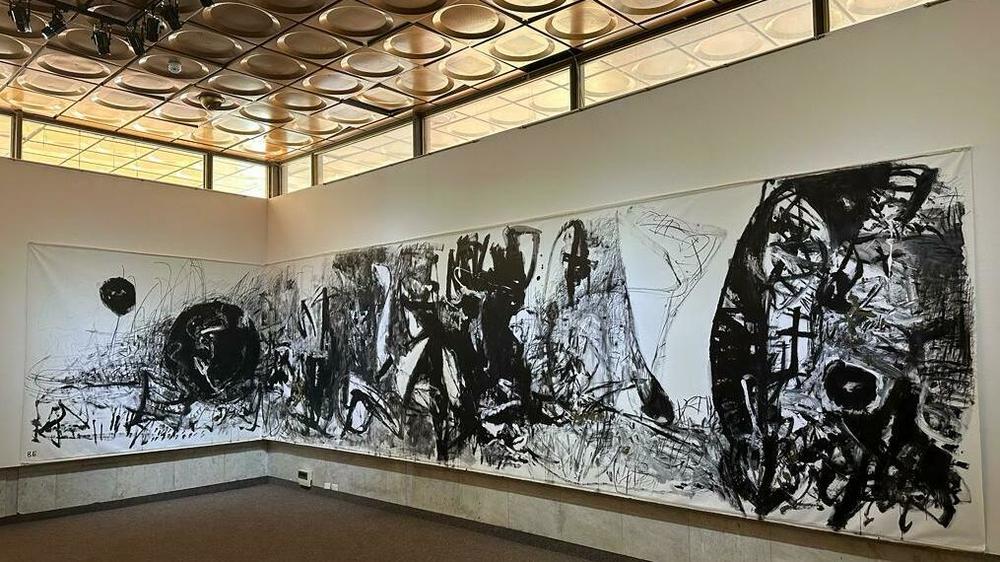 A painting by a Ukrainian artist depicts the war at an exhibition at Ukrainian House, a cultural center in Kyiv. The exhibit features works produced since the full-scale Russian invasion last year, and is part of a larger effort to encourage Ukrainians to discuss mental health issues.