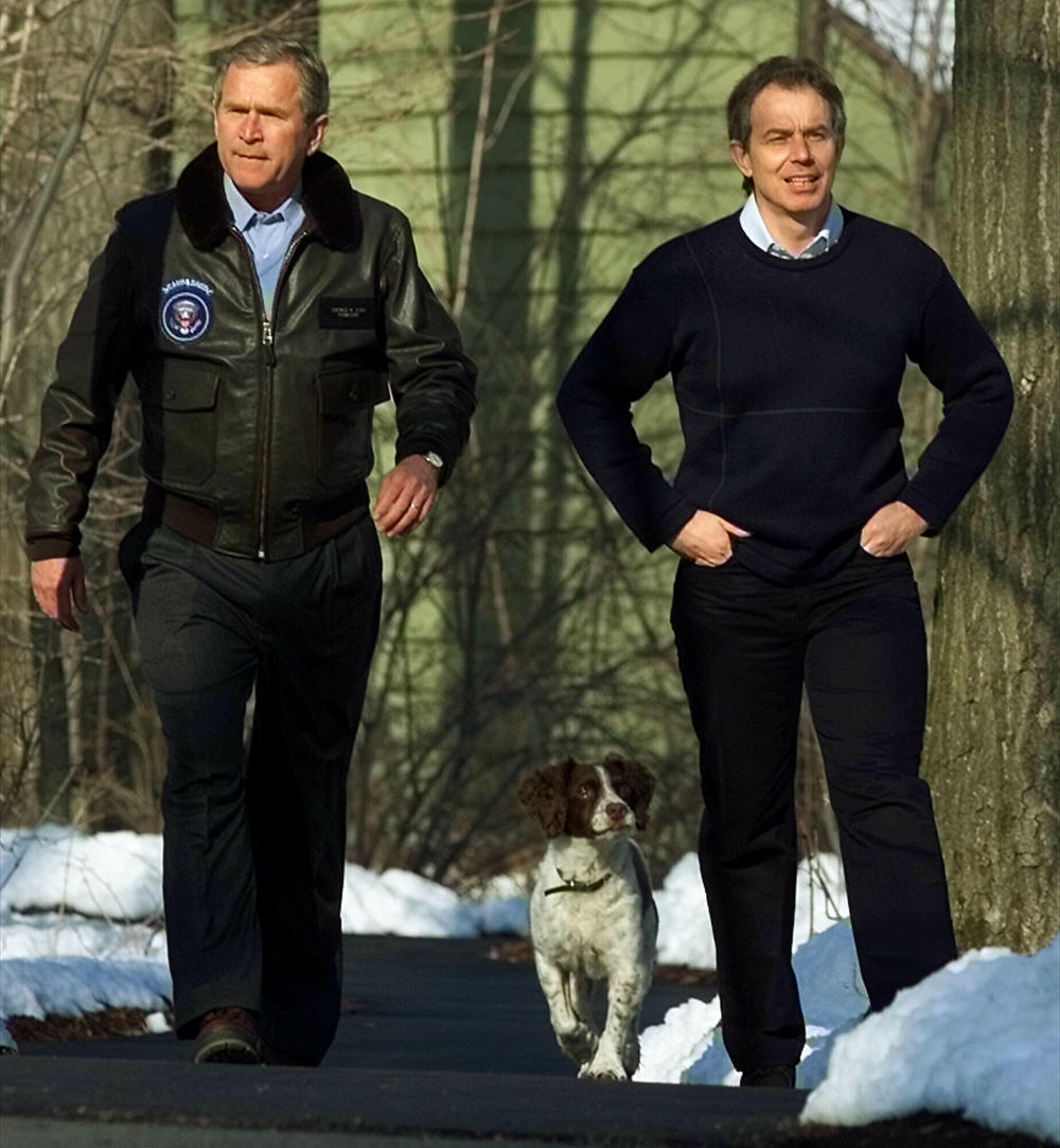 President George W. Bush walks with British Prime Minister Tony Blair at Camp David on Feb, 23, 2001.