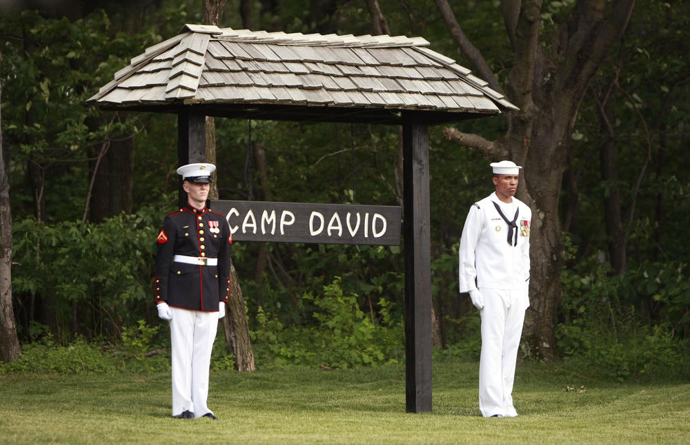 Members of an honor guard stand at attention for the arrival of the Crown Prince of Abu Dhabi to Camp David on June 26, 2008.