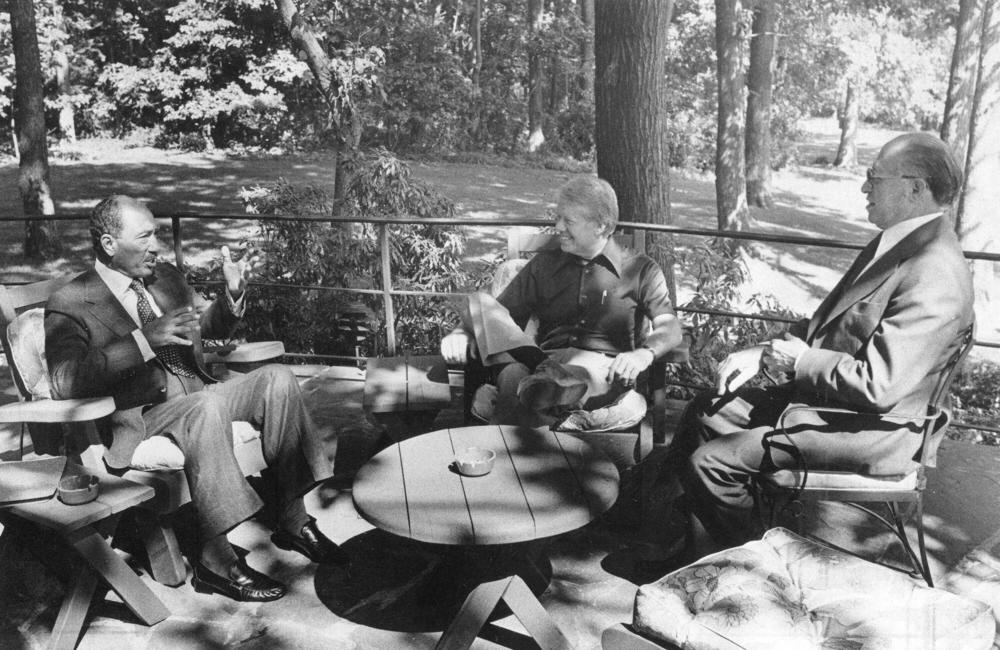 President Jimmy Carter, center, met with Egyptian President Anwar El Sadat and Israeli Prime Minister Menachem Begin at Camp David on Sept. 6, 1978.