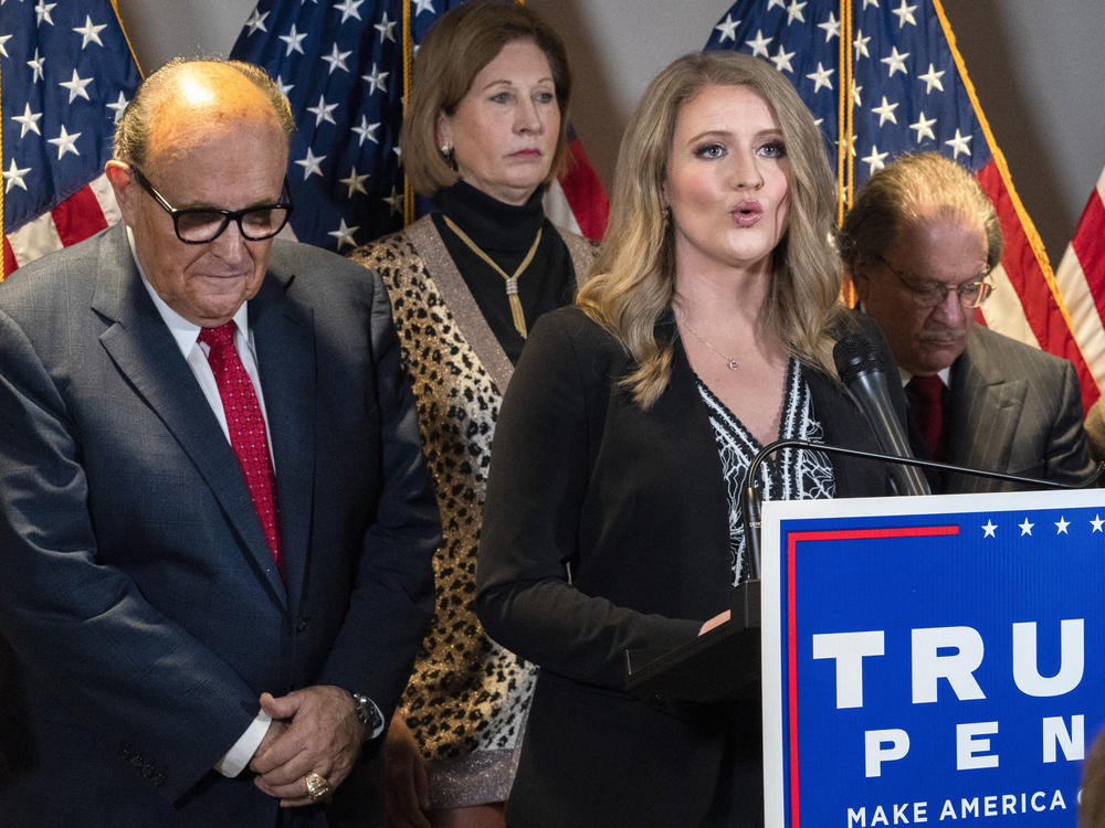 Jenna Ellis, right, is seen with other members of former President Donald Trump's legal team, including Rudy Giuliani, left, and Sidney Powell, back, at a Republican National Committee news conference on Nov. 19, 2020.