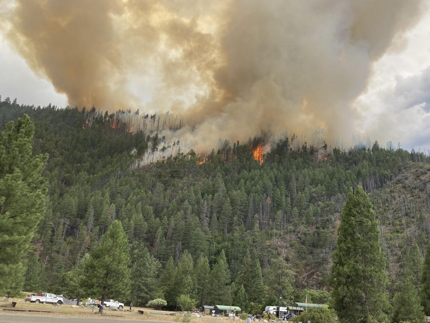 Smoke rises from the Head Fire in Klamath National Forest, Calif., on Tuesday Aug. 15, 2023.