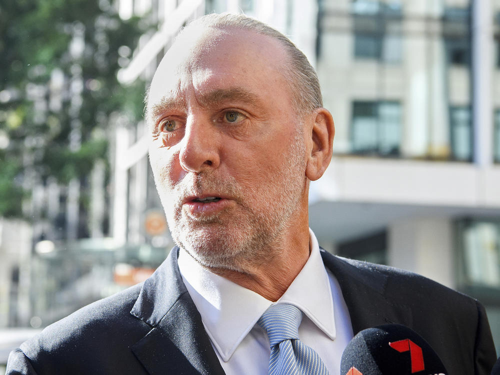 Hillsong church founder Brian Houston arrives Thursday at the Downing Centre Local Court in Sydney. He was ruled not guilty of a charge of concealing his father's child sex crimes.