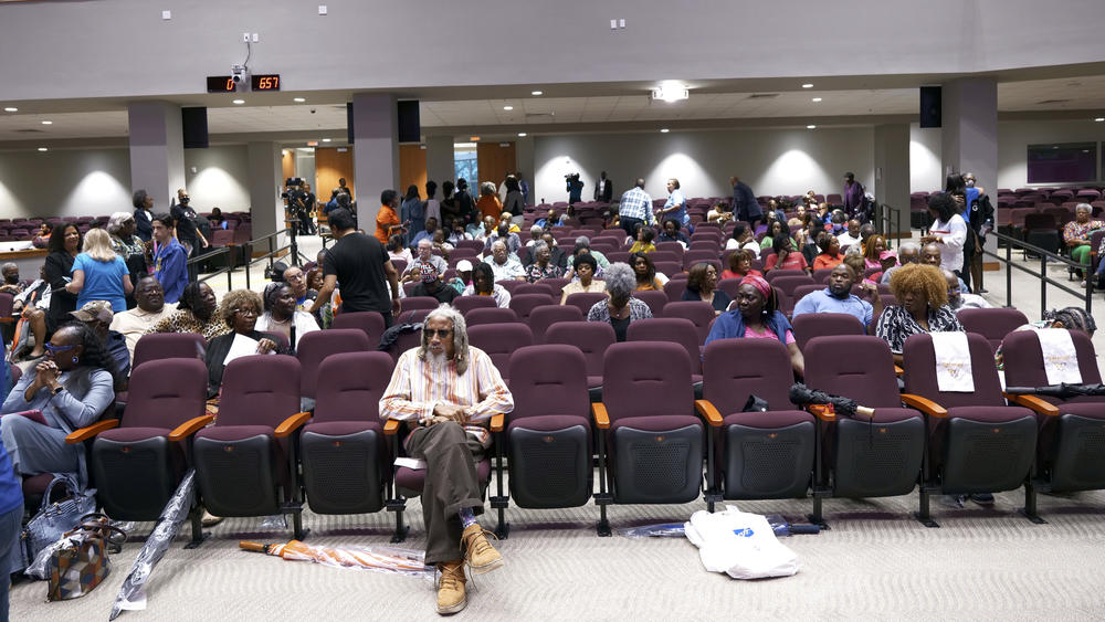 Lawmakers, teachers, school board members and parents gather for a town hall meeting on new Florida curriculum standards for Black history on Thursday in Miami Gardens, Fla.