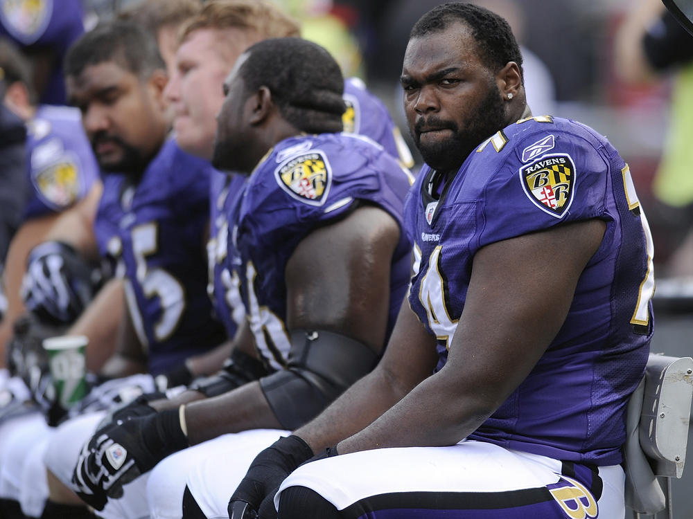 Baltimore Ravens offensive tackle Michael Oher sits on the bench during an NFL game against the Buffalo Bills on Oct. 24, 2010.