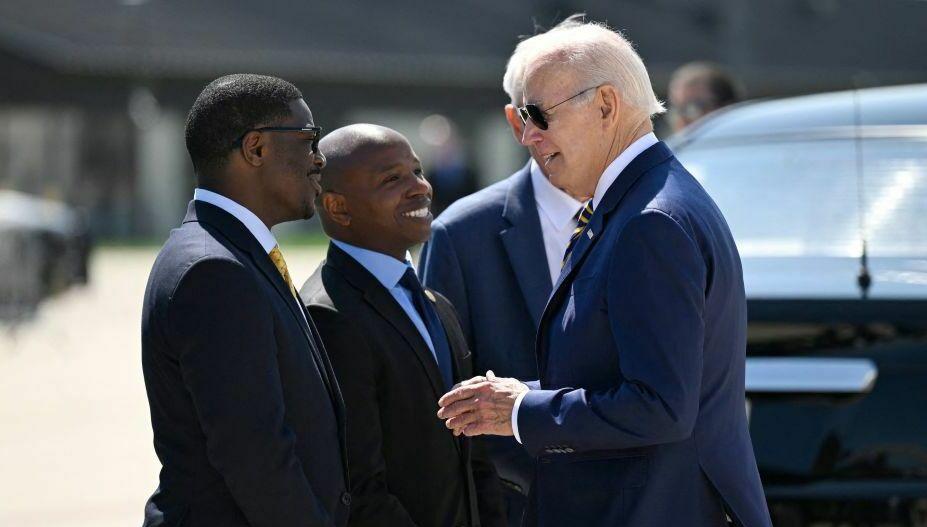 President Biden is welcomed by Milwaukee Mayor Cavalier Johnson (center) and Milwaukee County Executive David Crowley on arrival at Milwaukee International Airport Air National Guard Base in Wisconsin on Tuesday.