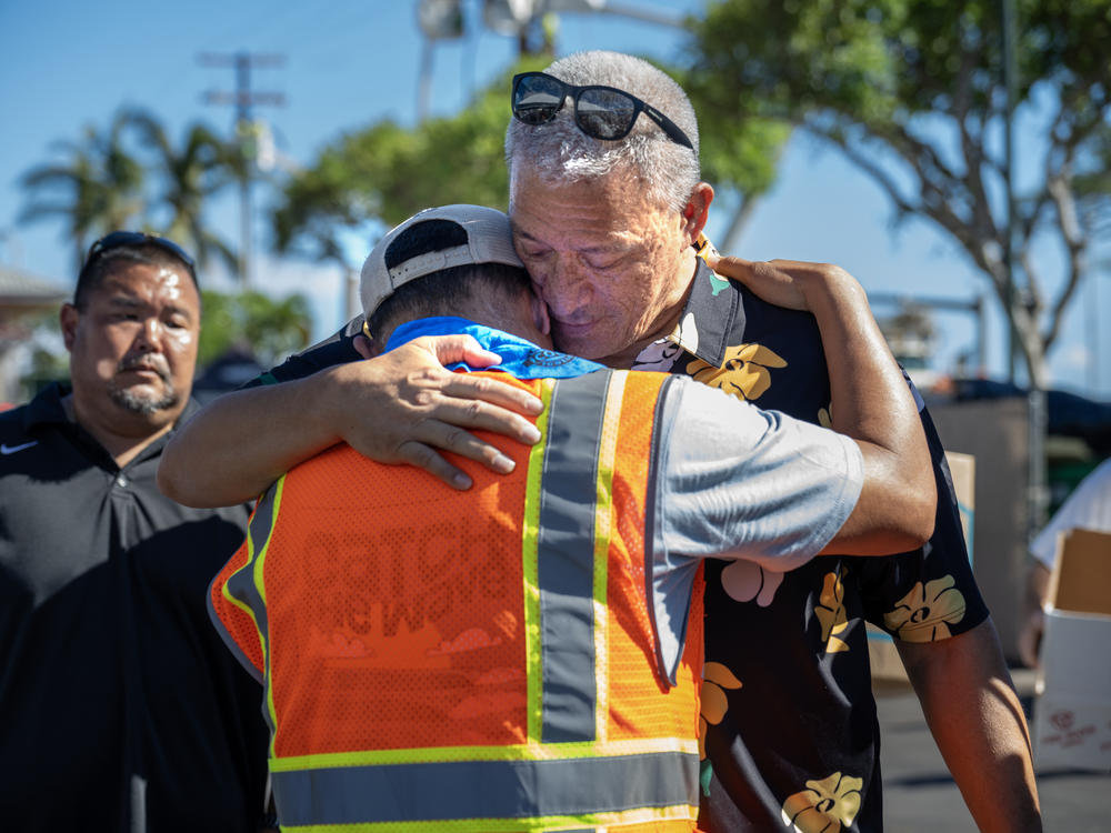 Maui County Mayor Richard Bissen Jr. visits a distribution center at Lahaina Crossing. A deadly wildfire destroyed the city of Lahaina, Maui.