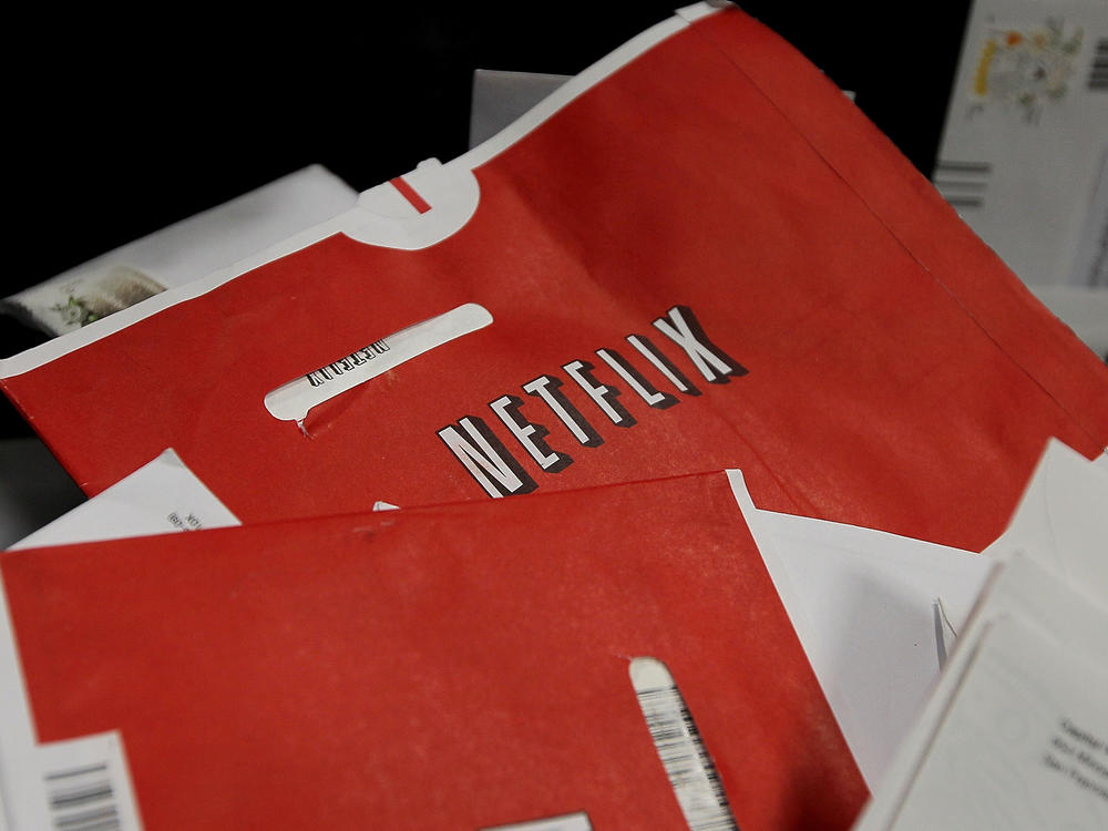 Red Netflix envelopes sit in a bin of mail at the U.S. Post Office sort center March 30, 2010 in San Francisco, California. The company is ending its DVD mailing service with a promotion.
