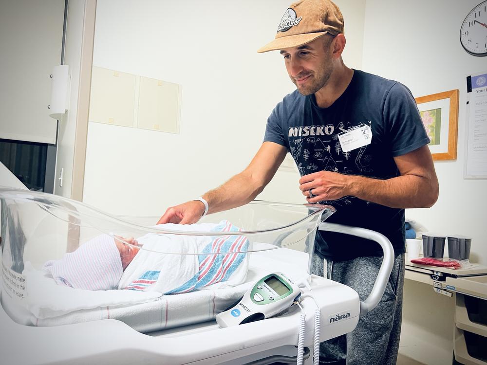 Greg Rosalsky looks at his new son in the hospital.