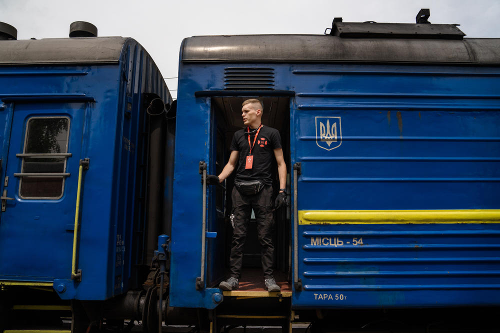 Rescue worker Eduard Skoryk waits to load evacuees onto a train in Pokrovsk, Ukraine.