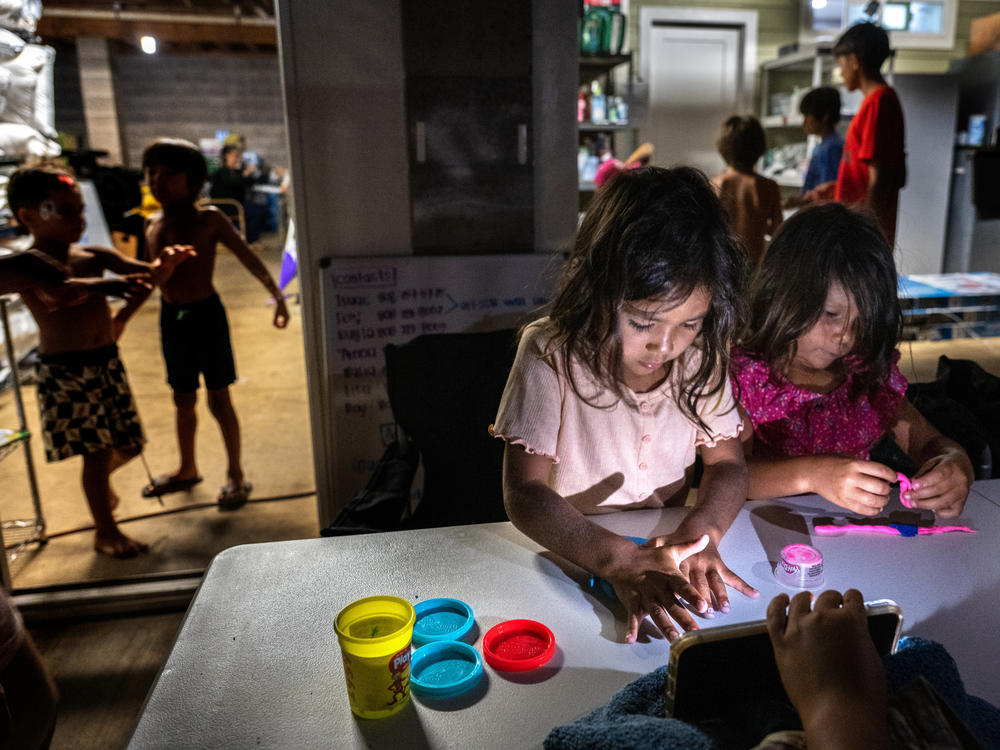 Five-year-old cousins Layla and Mila Cabanilla Okano are among the many children staying with members of their extended family at one property on Maui in the wake of the wildfires.