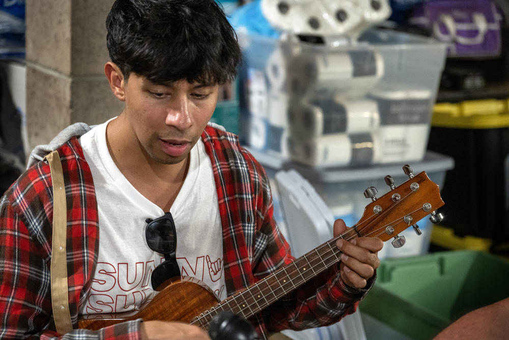 Max Louis is from Oahu and helping those who lost their homes in the wildfires. During some evening gatherings at the property, he plays music.
