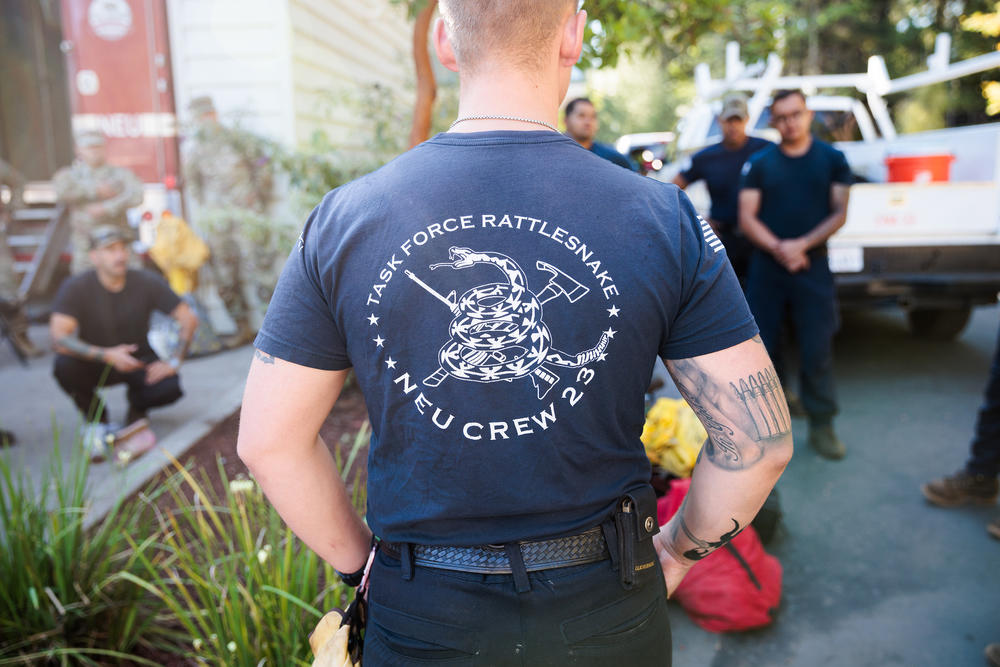Members of the California National Guard's Task Force Rattlesnake gather in Nevada City, Calif., to begin their day.
