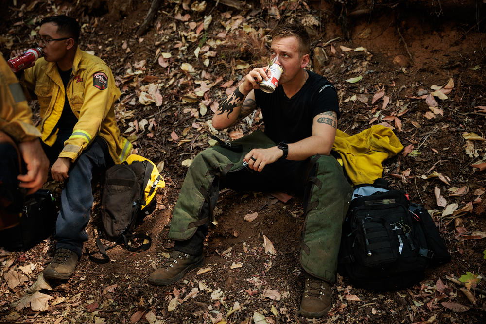 California National Guard Sgt. Tyler Bingham pauses for lunch while brush clearing with Task Force Rattlesnake.
