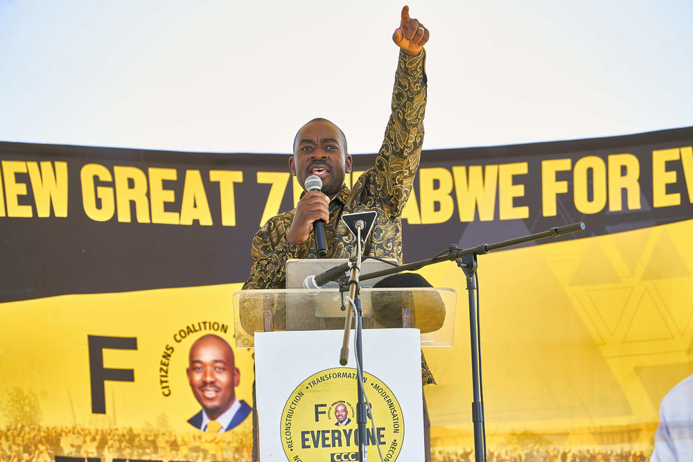 Opposition presidential candidate Nelson Chamisa, leader of the Citizens Coalition for Change (CCC), signals to the crowd with his finger, the party symbol, during a rally at White City Stadium in the city of Bulawayo, Zimbabwe, ahead of general elections on Wednesday.