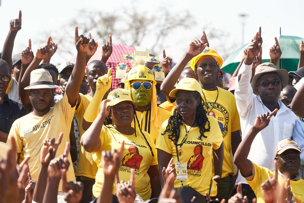Supporters of Zimbabwe's main opposition, the Citizens Coalition for Change (CCC), raise their fingers to symbolize change at a rally addressed by presidential candidate Nelson Chamisa at White City Stadium on Sunday in Bulawayo, Zimbabwe, ahead of general elections on Wednesday.