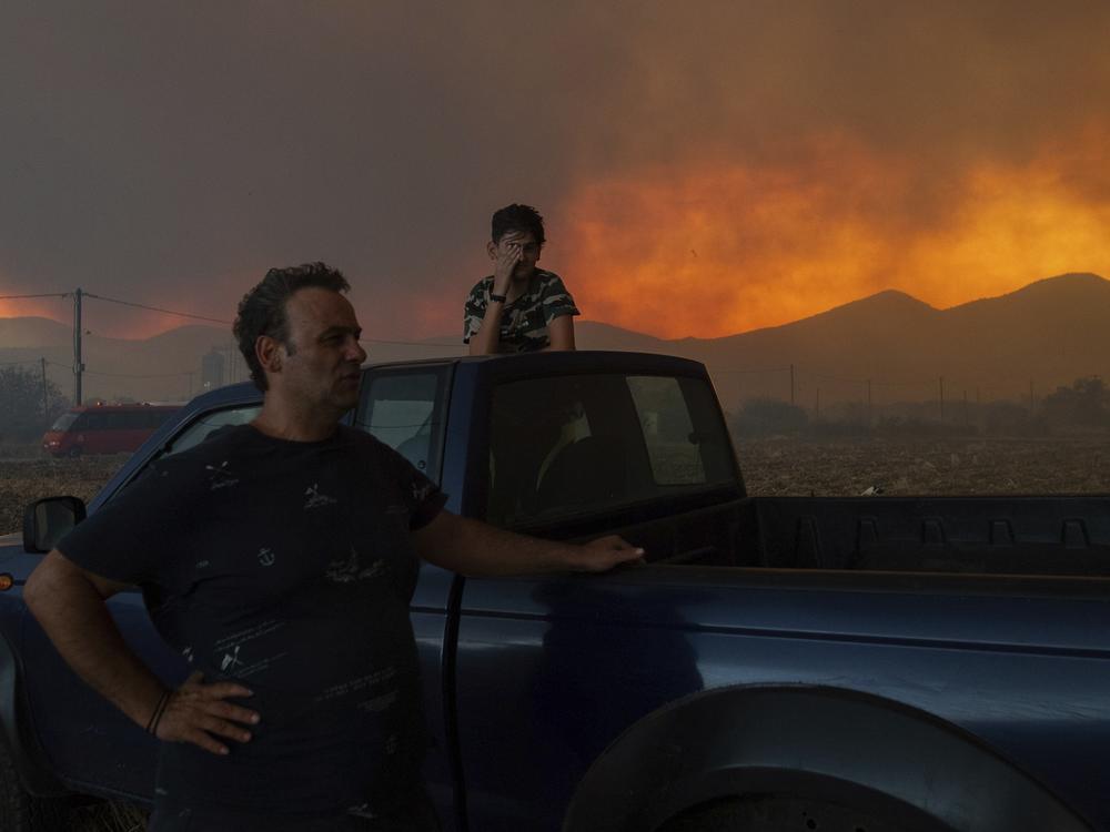 Residents watch the wildfire in Avantas village, near Alexandroupolis, in the northeastern Evros region of Greece on Monday.