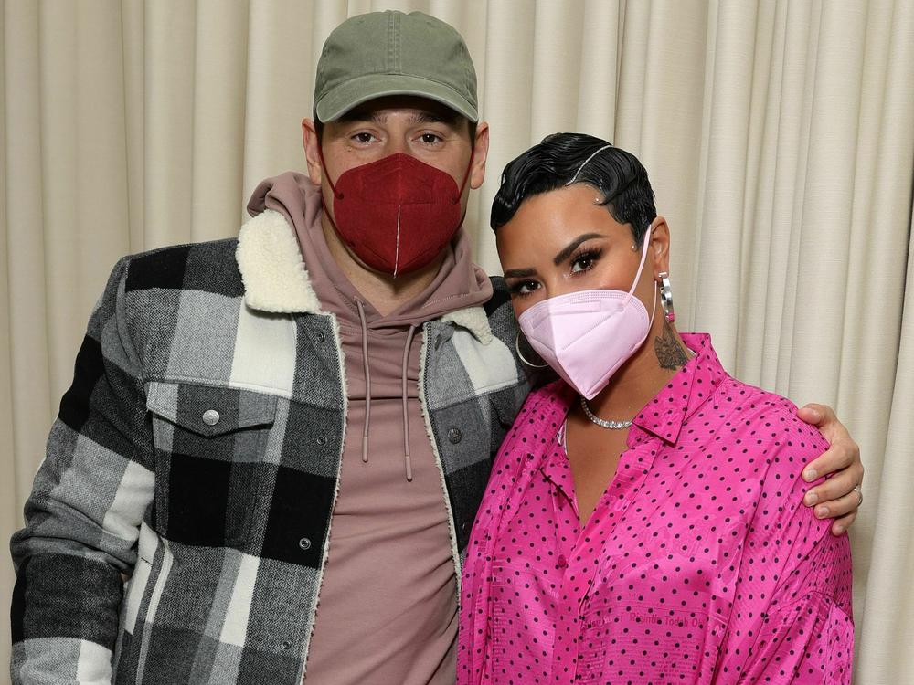 Scooter Braun and Demi Lovato attend an event in California in 2021.