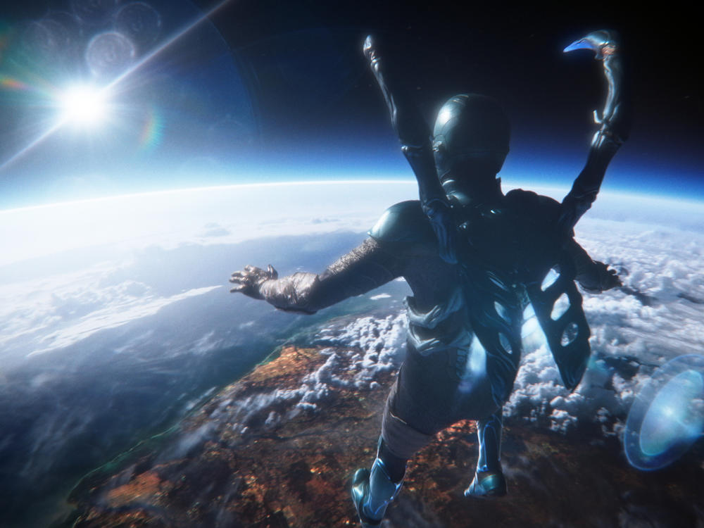Blue Beetle (Xolo Maridueña) looks to the future. So does the movie he's in.