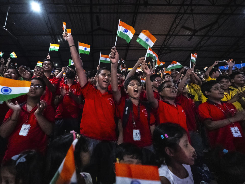 Schoolchildren celebrate the successful landing of the Chandrayaan-3 spacecraft on the moon, in a school in Guwahati, India, on Wednesday, Aug. 23, 2023.