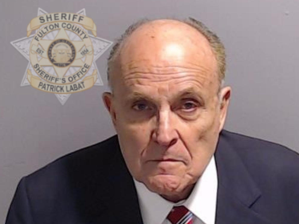 In this handout provided by the Fulton County Sheriff's Office, Rudy Giuliani, former personal lawyer for former President Donald Trump, poses for his booking photo on Aug. 23 in Atlanta.