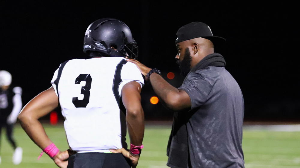 Roy Johnson (right) presented himself as a high school coach.