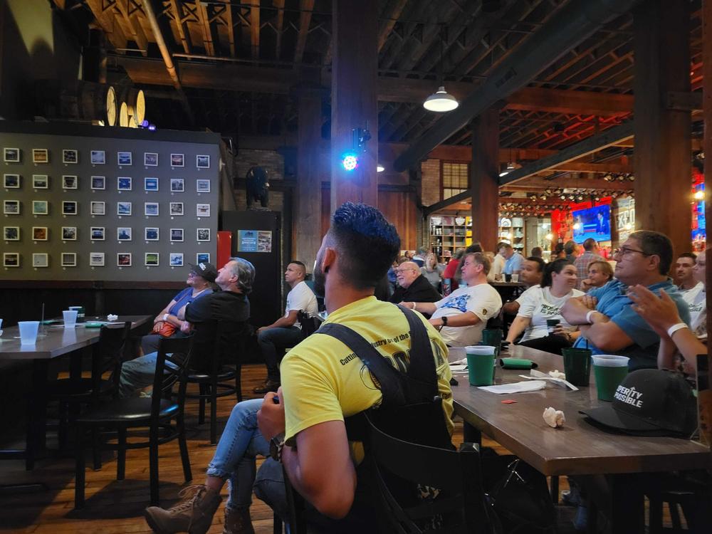 Wisconsin voters watch the first presidential debate at a brewpub in Milwaukee, Wisconsin on Wednesday evening.