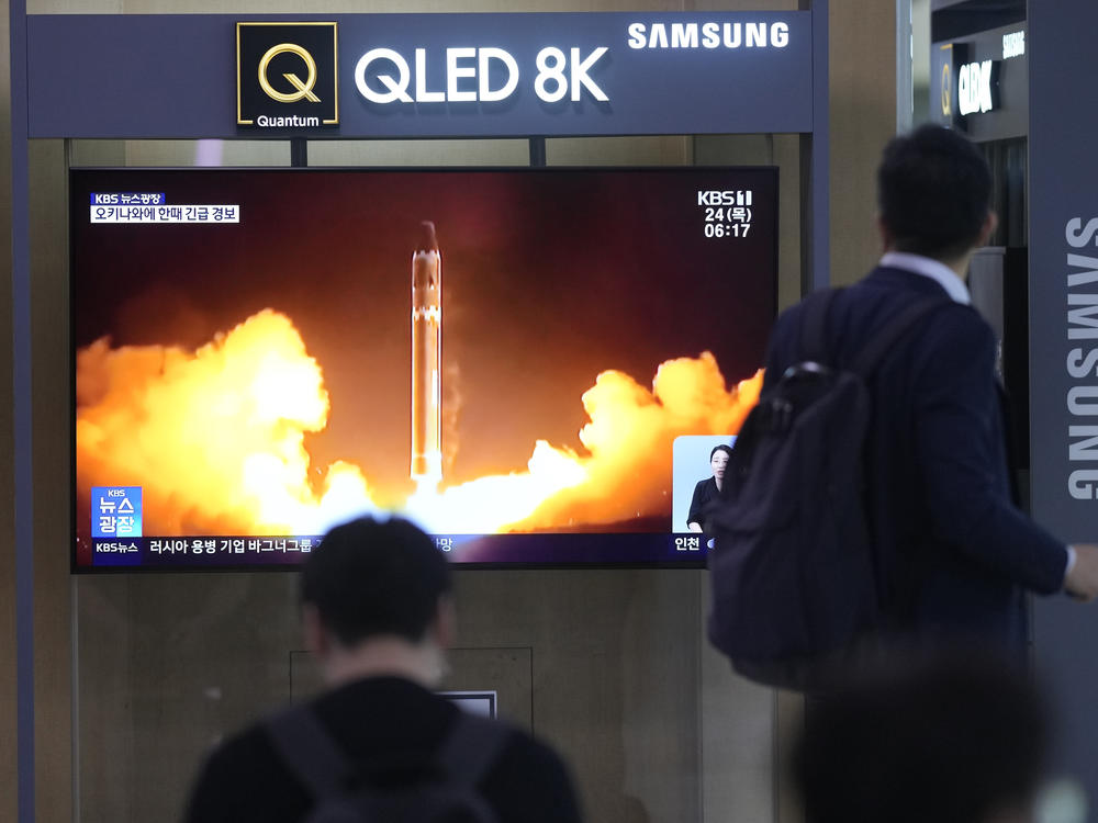 A TV screen shows a report of North Korea's rocket launch with file image during a news program at the Seoul Railway Station in Seoul, South Korea, Thursday, Aug. 24, 2023.