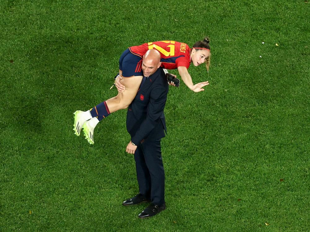 Rubiales' conduct following Spain's win has been roundly criticized, including by Spain's prime minister and unions representing the team's players. Here Rubiales is seen carrying Spain's Athenea del Castillo Beivide.