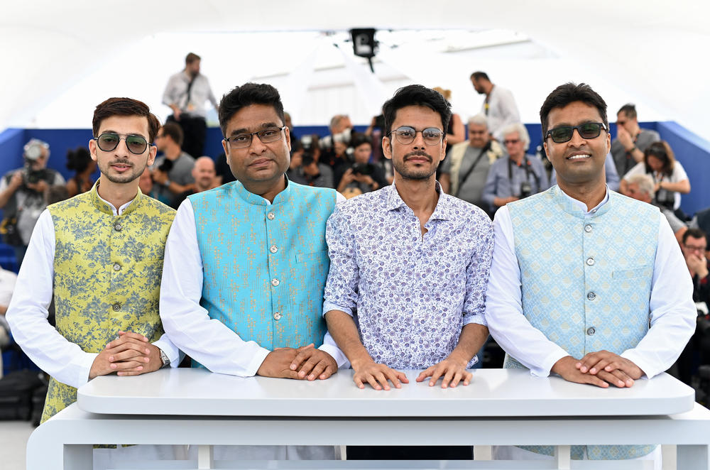 The documentary <em>All That Breathes </em>won the Golden Eye award for top documentary at the Cannes Film Festival in 2022. Pictured at Cannes: Salik Rehman (left), a friend who works with the bird-saving brothers profiled in the film, and the two brothers: Nadeem Shehzad (second from left) and Mohammad Saud (right). The film's director, Shaunak Sen, stands between the siblings.
