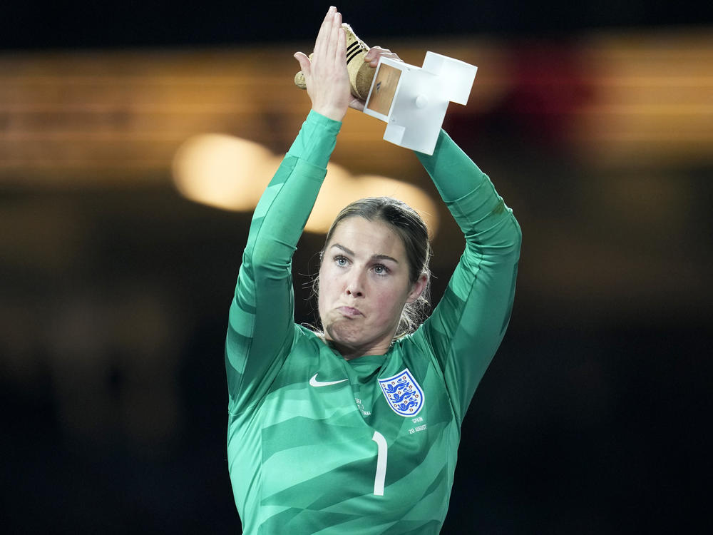 England's goalkeeper Mary Earps applauds after receiving the Golden Glove award for the tournament's best goalkeeper, at the end of the Women's World Cup soccer final between Spain and England in Sydney, Australia, Sunday, Aug. 20, 2023.