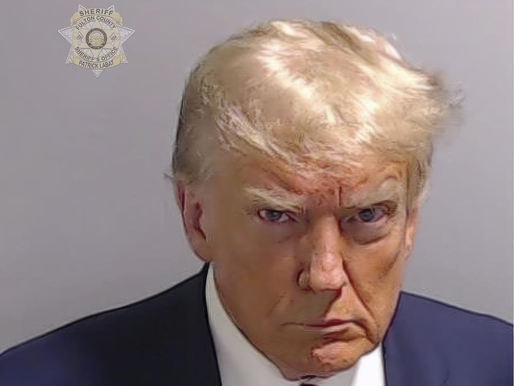 This booking photo, provided by Fulton County Sheriff's Office, shows former President Donald Trump after he surrendered and was booked at the Fulton County Jail in Atlanta this week. Trump is accused by District Attorney Fani Willis of scheming to subvert the will of Georgia voters.